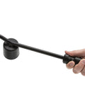 Heavy duty hubcap remover tool for auto mechanics with durable steel build, rubber hammer face, and wide pry blade held in hand.