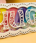 Decorative card with "HUGS" crafted from 26 Piece Alphabet Letter Metal Cutting Dies For Scrapbooking Card Making And Paper Crafts Dope Die Cuts Vintage 5 cm Height High Quality Steel Die Cut Set From Alinacutle.
