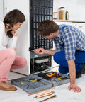Technician using Refrigerator Filter Dryer With Access And Service Valve And Three In One HVAC Tool Kit for refrigerator repair