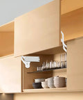 Cabinet Door Hinges, Hydraulic Arm Mechanism Hinges installed in wooden kitchen cabinet with open top-lift door showing pneumatic arm
