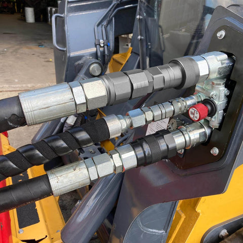 Flat Face ISO 16028 To ISO 5675 Pioneer Style Hydraulic Quick Connect Coupler Adapter Set with Dust Caps installed on skid steer.