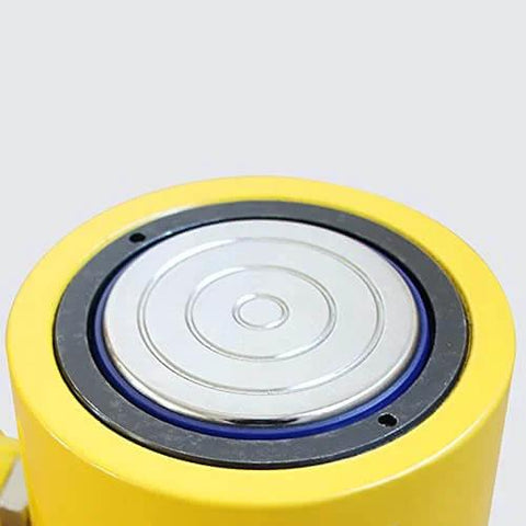 Close-up of the yellow top view of Beefy 50T Hydraulic Cylinder Jack With 50mm Stroke, Solid Single Acting Ram For Lifting, Corrosion Resistant Metal Construction, 110000 LBS Capacity, 2 Inch Travel, Easy Load and Lift, PreAsion.