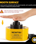 Hand pressing on yellow NEWTRY Hydraulic Ram Jack 30T Hydraulic Cylinder Low Profile Ram Jack Multi-Section 2.13” Stroke