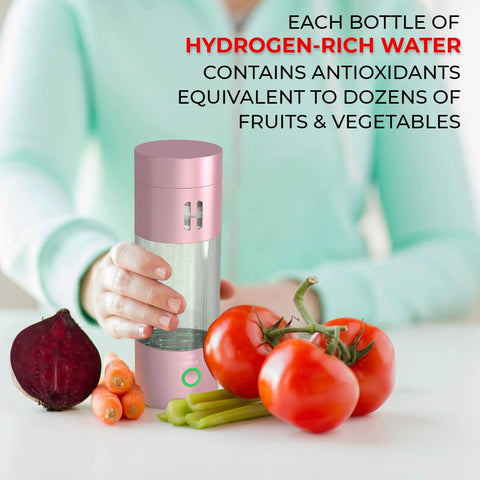 Person holding hydrogen-rich water bottle next to fresh vegetables, promoting antioxidant content