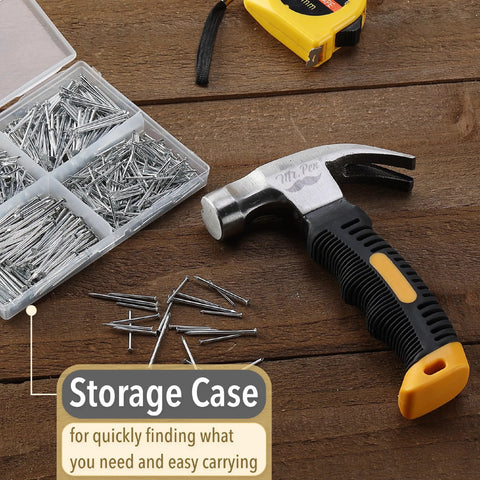 Bulk picture hanging kit with 600 galvanized nails in four sizes plus an 8 ounce hammer on a wooden surface with storage case