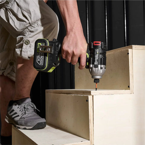 Using a drill with the 20 Piece Impact Hex Bit Set With Magnetic Tips Quarter Inch Shank S2 Steel CNC Machined Bits In Storage Box on stairs.