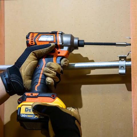 Person using All-In-One Magnetic 14-In-1 Screwdriver Set With 13 Bits And One Quarter Inch Nut Driver, Adjustable Blade Length For Tight Spaces, Impact Rated Blade Removable For Use As Impact Driver, Stainless Steel Bits, Heavy-Duty Pro Grade Klein Tools.