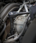Heavy Duty Half Inch Drive Master Impact Socket Set With Sixty Five Pieces For SAE And Metric Sizes in use on engine