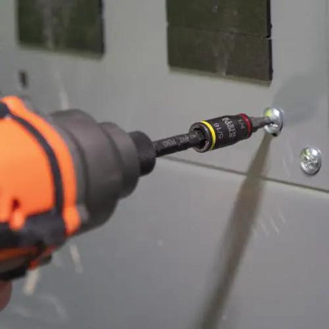 Close-up of 3-In-1 Flip Impact Socket Set for Quick Drive Size Swaps in use, installed in power drill, fastening a screw on a panel.