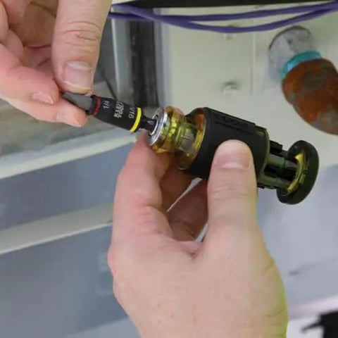 Hands using 3-In-1 Flip Impact Socket Set for Quick Drive Size Swaps, No-Fuss 1/4 and 5/16 Hex Nut Drivers, Klein Tools.