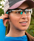 Individual wearing Impact Resistant Sport Glasses With UV Protection And Non Slip Frame outdoors