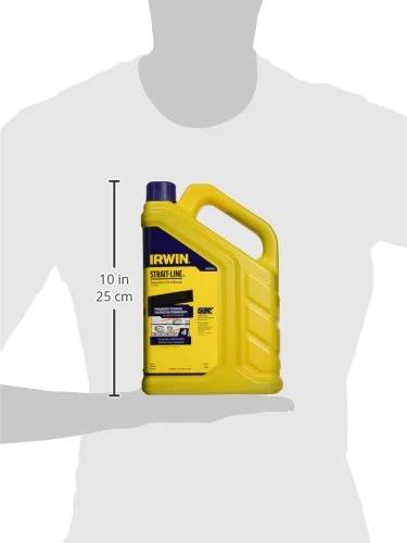 Person holding a 4 lb bottle of Indigo Blue Permanent Staining Marking Chalk with flip cap for outdoor field layouts.