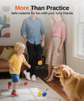 Family playing indoors with Full Choice Practice Golf Balls (20 Pack), Limited-Flight Training Balls, 5 Colors, with dog and child.