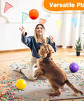 Woman and dog playing with 8PCS Inflatable Playground Balls, 8.5Inch Bouncing Sensory Balls for Kids Birthday Parties, colorful room.