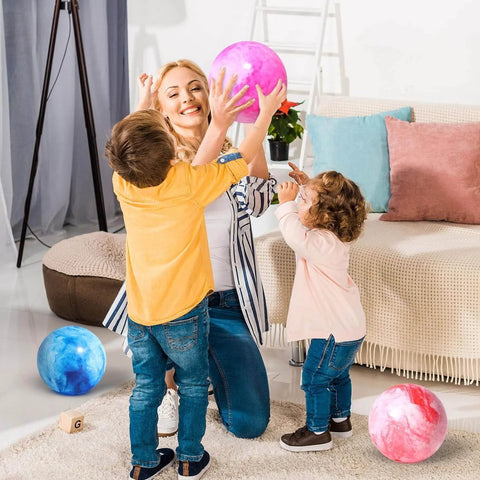 2PCS Inflatable Playground Balls, 8.7 Inch Marbleized Bouncy Balls in play indoors with children.