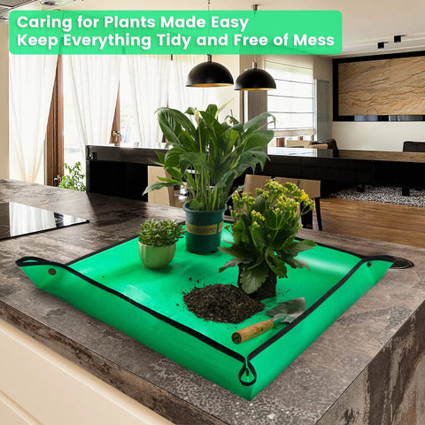 Indoor Plant Repotting Mat For Transplanting And Mess Control, Waterproof 26.8 Inch Square Potting Tray on kitchen counter with plants and soil.