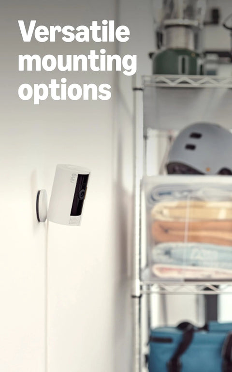 Compact indoor security camera mounted on wall for versatile installation; captures crisp 1080p HD video with color night vision.