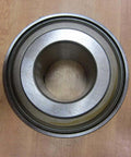 Heavy-Duty Industrial Bearing MB351-12-PA Rexnord MB35112PA Sealed Ball Bearing for Heavy Machinery on wooden background