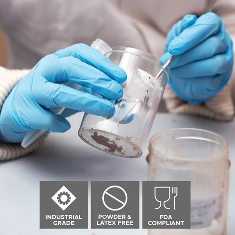 Person using DuraSkin Nitrile Gloves 3.5 Mil Large Powder Free Micro Textured Blue Industrial for handling chemicals.