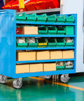 Blue industrial storage cart with green bins on Heavy Duty Industrial Casters 6 x 2 Inch With Cast Iron Wheels And Roller Bearings
