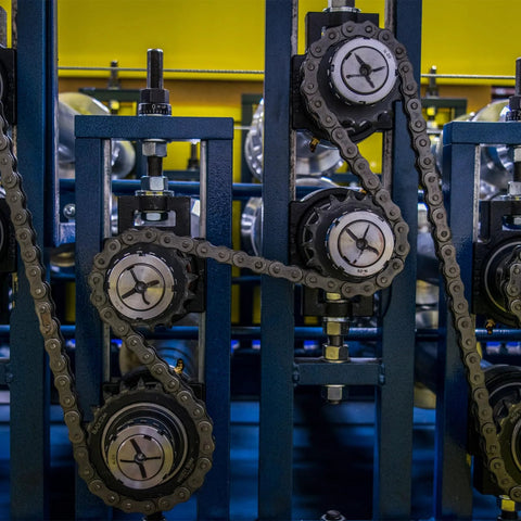 Industrial machinery with No 40 Chain Roller Sprocket B Type for Single Strand Chains, carbon steel, black oxide finish.