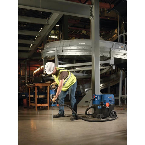 Worker using One And One Eighth Inch SDS-Plus Bulldog Xtreme Max Rotary Hammer For Concrete Drilling And Chiseling In Masonry