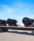 Flatbed truck loaded with machinery secured by 3/8 Inch x 6 FT Grade 70 Binder Chain with Clevis Grab Hooks - G70 Transport Tow Chain