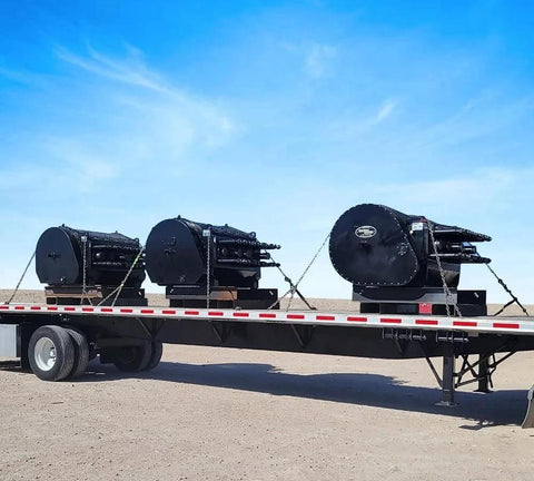 Flatbed truck loaded with machinery secured by 3/8 Inch x 6 FT Grade 70 Binder Chain with Clevis Grab Hooks - G70 Transport Tow Chain