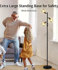 Industrial Tree Floor Lamp With Three Diamond Head Lights 1200 Lumen Edison LED Bulbs in living room setting with family