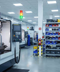 Industrial workstation with Three Stack LED Andon Tower Signal Light Red Yellow Green with control panel in manufacturing setting