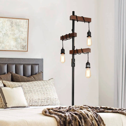 Industrial Dimmable Floor Lamp With 3 Heads 68 Inch Tall Tree Floor Lamp In Black Metal And Wood next to bed in bedroom