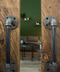 Industrial Pipe Decor Barn Door Handle 8 Inch With Authentic Steel Grey Iron Fittings Flanges And Pipes For Custom Vintage Hanging Doors DIY Kit With Hardware For Easy Installation And Rustic Farmhouse Style, installed on wooden doors.
