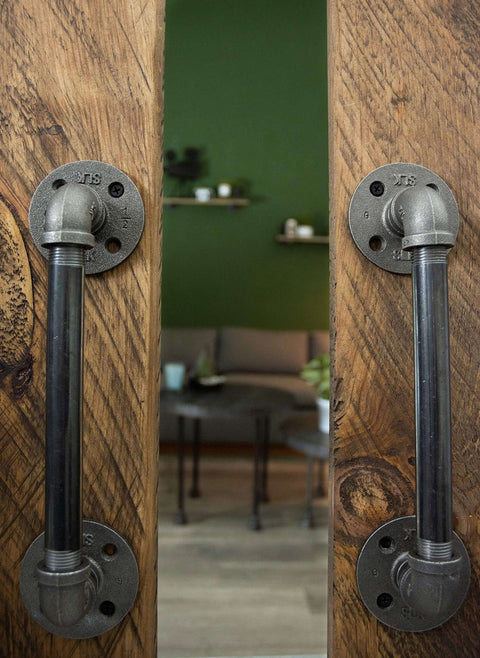 Industrial Pipe Decor Barn Door Handle 8 Inch With Authentic Steel Grey Iron Fittings Flanges And Pipes For Custom Vintage Hanging Doors DIY Kit With Hardware For Easy Installation And Rustic Farmhouse Style, installed on wooden doors.
