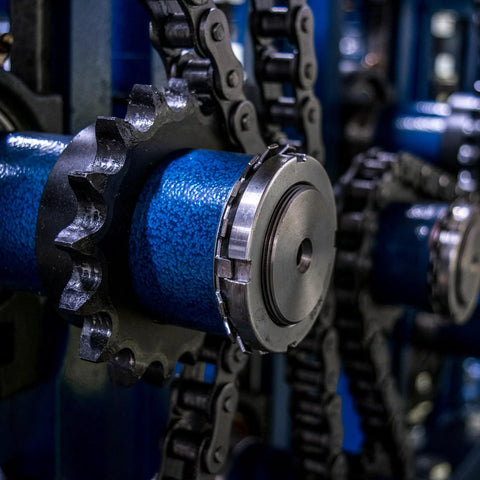 Close-up of No 40 Chain Roller Sprocket B Type for single strand chains, 18 teeth carbon steel with keyway and set screws, installed.