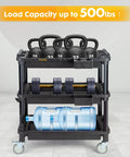 Multi Use Rolling Cart With Power Strip For Heavy Duty Workhorse Style Setups In Shops, Industrial Grade Plastic Utility Cart With 3 Deep Shelves, 500 Lb Capacity, 32.4 x 18.3 Inches, Black loaded with gym weights and water container