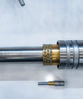 Close-up of Self Lubricating Sleeve Bearing Set Of Three Three Quarter Inch Bore Seven Eighths Inch Outer Diameter installed on shaft.