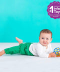 Baby playing with Bright Starts Oball Easy Grasp Classic Ball BPA-Free Infant Toy in Red, Yellow, Green, Blue, Age Newborn and up, 4 Inches.