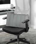 Inflatable seat cushion on office chair, compact, gray PVC material, for travel and comfort