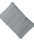 Gray inflatable PVC seat cushion for travel and comfort, compact and portable. Size: 260x410 mm.
