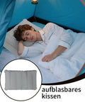 Man sleeping on inflatable seat cushion in tent, PVC material, lightweight and portable for travel, 260x410 mm size.