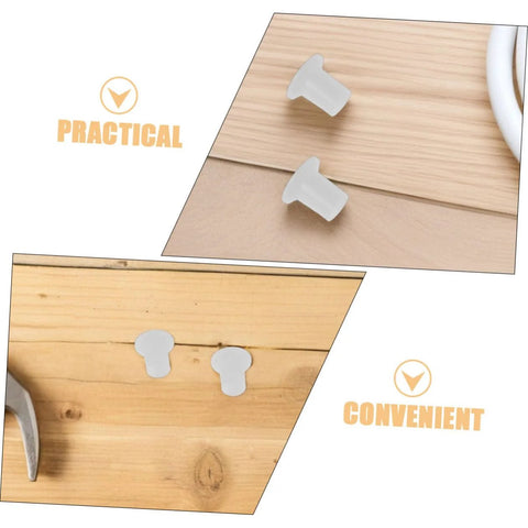 Two white plastic edge covers and side bushings on a wooden surface from 50 Pack Inline Skate Edge Covers and Side Bushings for Roller Skates Universal Bearing Replacement Kit Enhances Performance and Appearance, Durable Plastic Caps, Easy Install, Ideal for All Inline Skates.