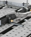 Image of Heavy Duty Five Eighths Inch Insert Table Mounted Clamp With Rear Crank Handle on BuildPro Welding Table.