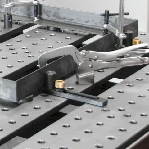 Image of Heavy Duty Five Eighths Inch Insert Table Mounted Clamp With Rear Crank Handle on BuildPro Welding Table.
