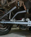 1.25 inch Heim joint rod end kit with tube adapters, installed on vehicle suspension, showcasing left and right hand thread chromoly joints