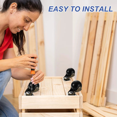 Person installing 1.5 Inch Ball Caster Wheels for Furniture Swivel Casters with screwdriver on wooden furniture.