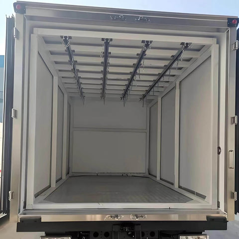 Rear view of an empty industrial container truck showing interior rails for heavy load transport and smooth silent sliding material handling.