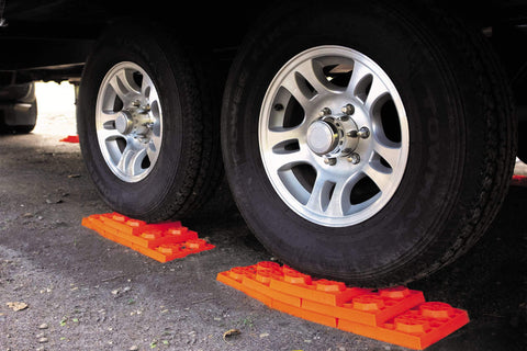 Interlocking RV Leveling Blocks 10 Pack With Nylon Storage Bag For Trailer Motorhome And Vanlife Up To 40,000 Lbs Capacity Orange Made In USA By Tri-Lynx Lynx Levelers Durable Heavy Duty Stability For Uneven Terrain And Easy Quick Leveling under RV tires
