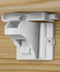 Keep curious kids safe with invisible magnetic cabinet locks that install quickly with 3M adhesive, shown inside wooden cabinet