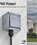 Weatherproof Outdoor Light Switch 1-Gang 2-Way IP66 Rated installed outside with water droplets, house background visible.