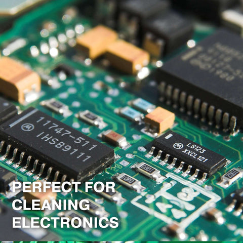 Close-up of electronic circuit board with text overlay "Perfect for Cleaning Electronics," highlighting use of Isopropyl Alcohol 99.9% Technical Grade, 32 Oz Bottles Four Pack, High Purity Cleaning Solvent For Labs And Electronics.